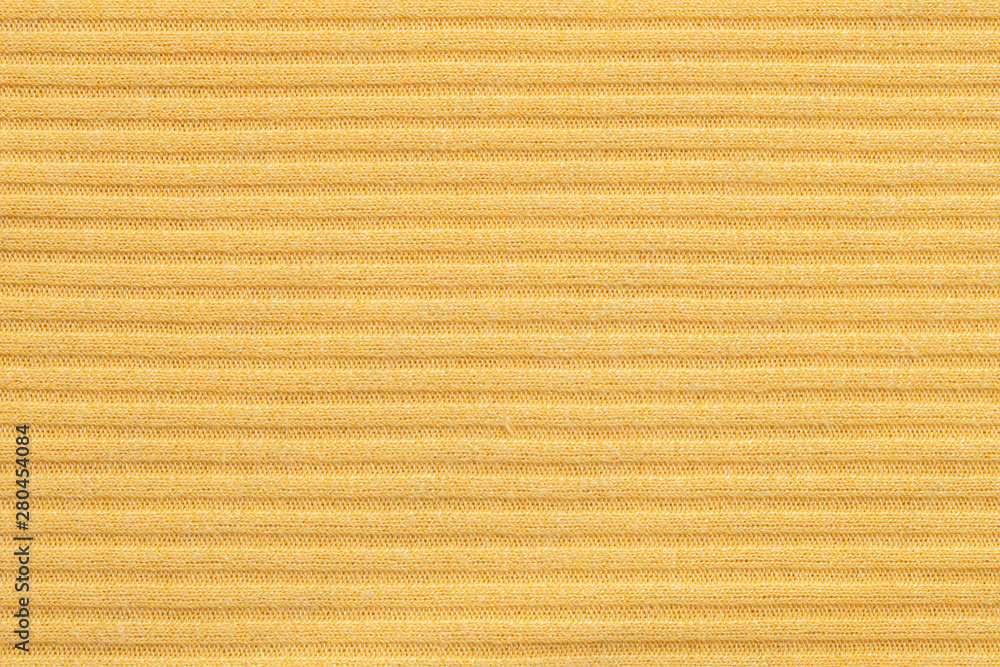 Closeup abstract pattern at yellow women's clothing textured background Closeup abstract pattern at yellow women's clothing textured background