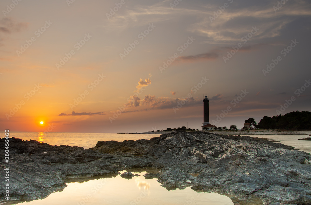 Croatia, Dugi otok, Veli rat, 8. july 2019. On the photo is famous lighthouse. Photo was taken at sunset in summer. Horizontal photo. 