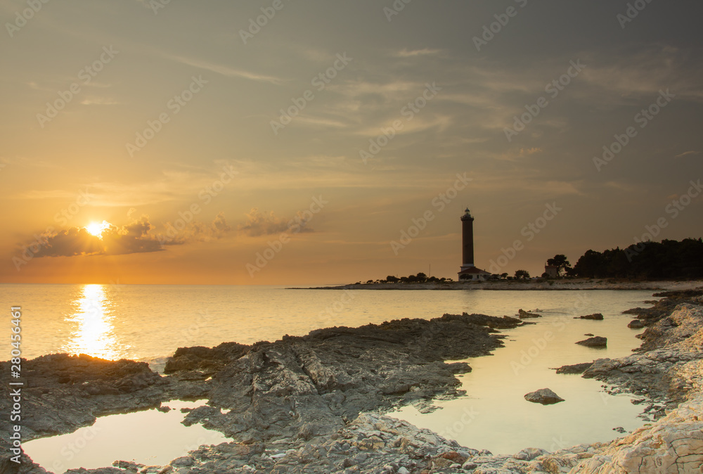 Croatia, Dugi otok, Veli rat, 8. july 2019. On the photo is famous lighthouse. Photo was taken at sunset in summer. Horizontal photo. 