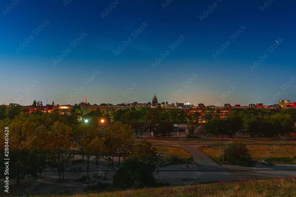 mauerpark in the night with cityscape in the background
