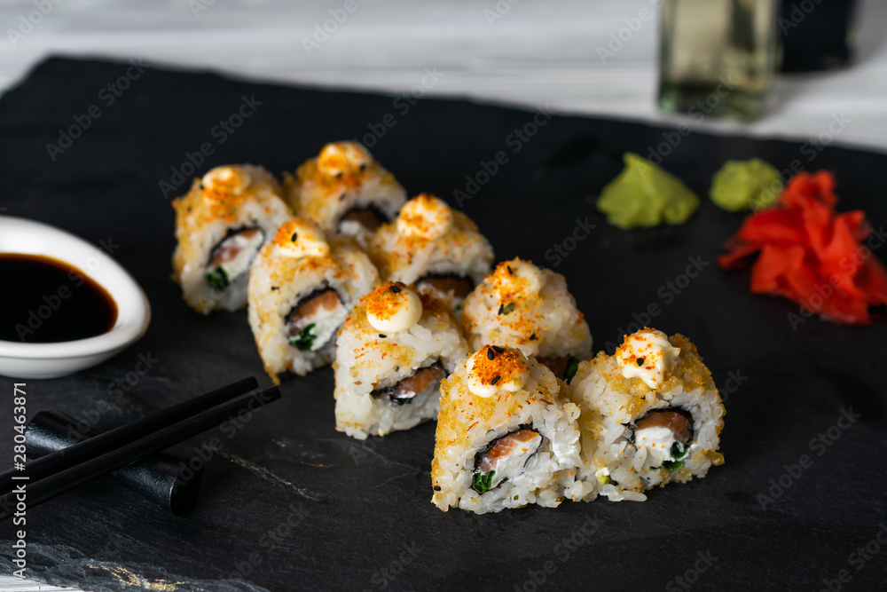 Sushi rolls filled with salmon fish and cream cheese Sushi rolls filled with salmon fish and cream cheese