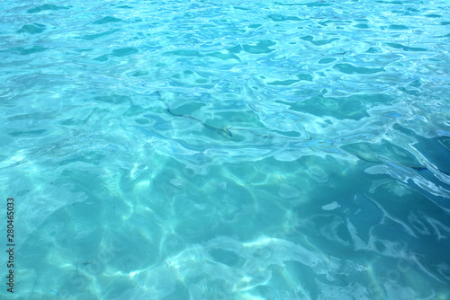 Tropical turquoise blue ocean water. Caribbean shining blue water background © alekosa