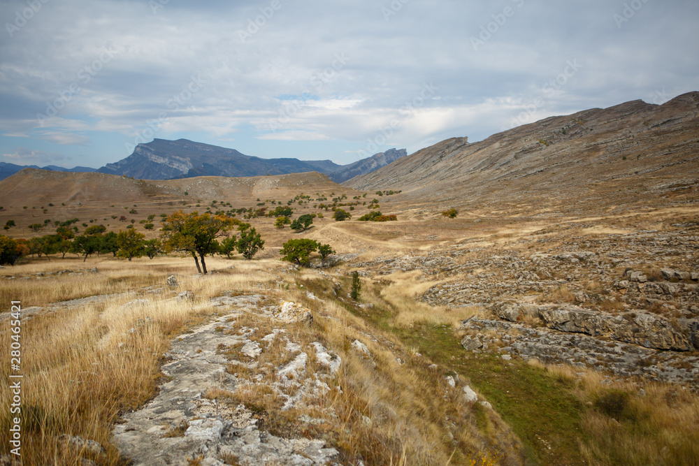 Photo of picturesque mountain area and cloudy sky Photo of picturesque mountain area and cloudy sky