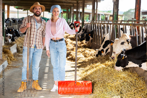 Two farmers posing on dairy farm