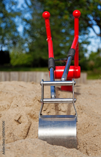 a new toy excavator in the sandbox photo