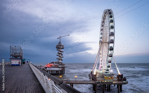 Popular ferris wheel on the pier of Scheveningen, The Hague. photo