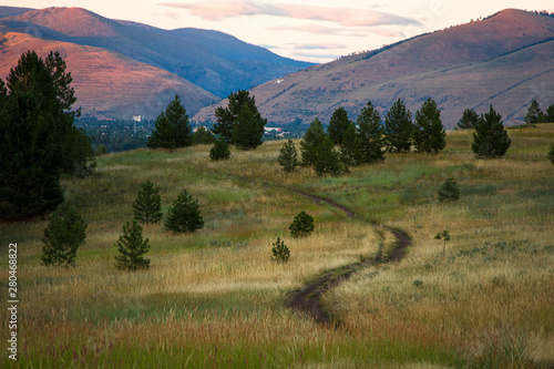 A trail leads towards Missoula, Montana at Blue Mountain. photo