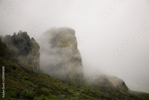 Mountainous landscape with fog in Lescun Valley, Pyrenees, France.