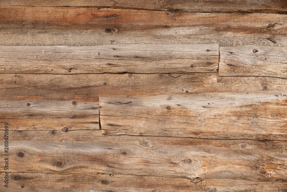 Naklejka premium Textured brown old wooden plank background. Texture.