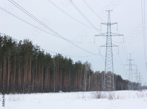 high voltage power lines at blue sky. electricity distribution station. high voltage electric transmission tower.