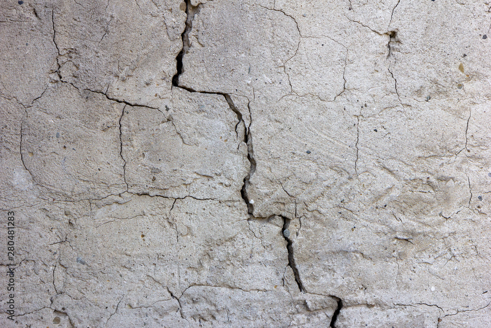 a crack in the plasterwork of a wall 