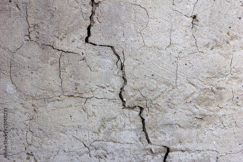 a crack in the plasterwork of a wall 