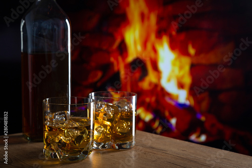 Glass of whiskey in front o...