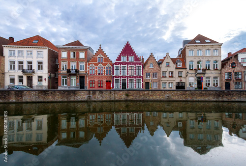 reflection of houses in canal water in Bruges. Belgium © Alexey Oblov