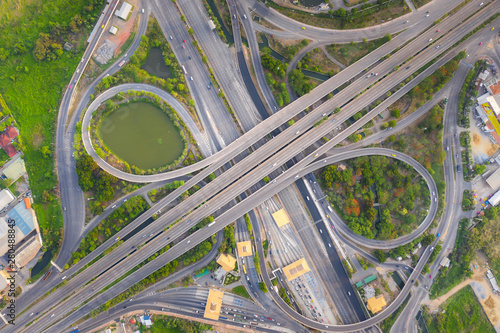 Aerial View Above of Busy Highway Road Junctions at day. The Intersecting Freeway Road Overpass The Eastern Outer Ring Road of Bangkok.