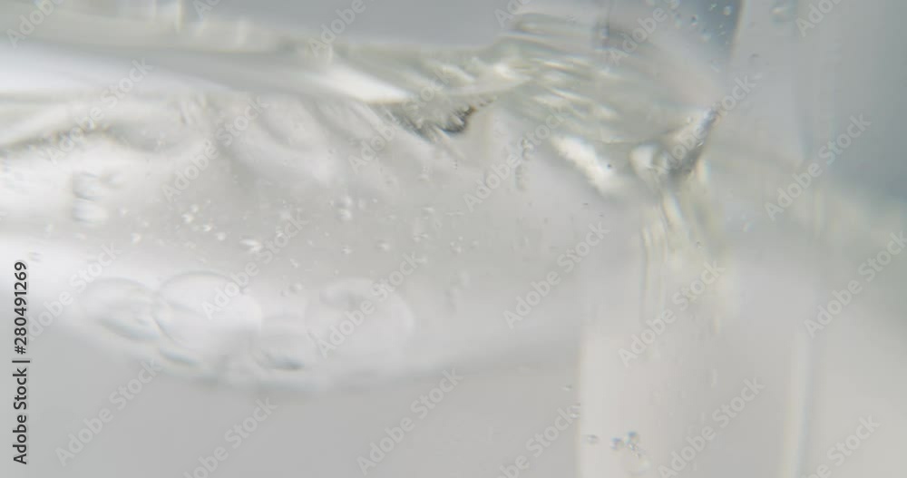 a close up detail shot of air bubbles floating in a white transparent viscous liquid. art experimental footage a close up detail shot of air bubbles floating in a white transparent viscous liquid. art experimental footage