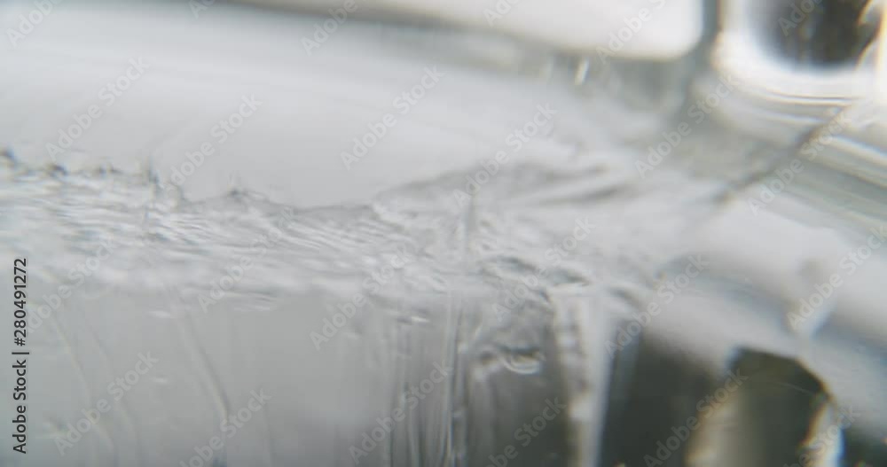 close up detail shot of a transparent viscous liquid. small streams of liquid are falling down and leaving trails. art experimental footage close up detail shot of a transparent viscous liquid. small streams of liquid are falling down and leaving trails. art experimental footage
