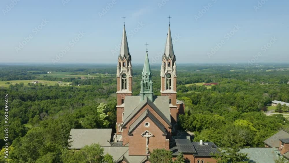 Holy Hill National Shrine of Mary, Wisconsin, USA, aerial forward fly-over through spires drone footage. Holy Hill National Shrine of Mary, Wisconsin, USA, aerial forward fly-over through spires drone footage.