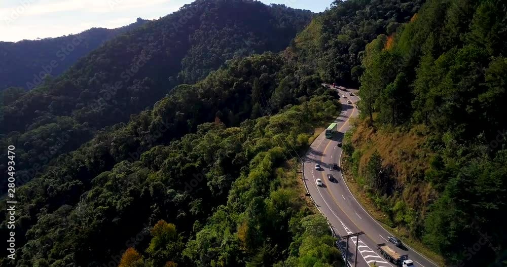Curved highway path over the mountains. Craning camera movement. Curved highway path over the mountains. Craning camera movement.