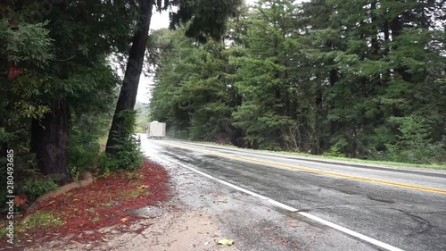 RV motorhome driving through the rainforest on California's Pacific Coast Highway..