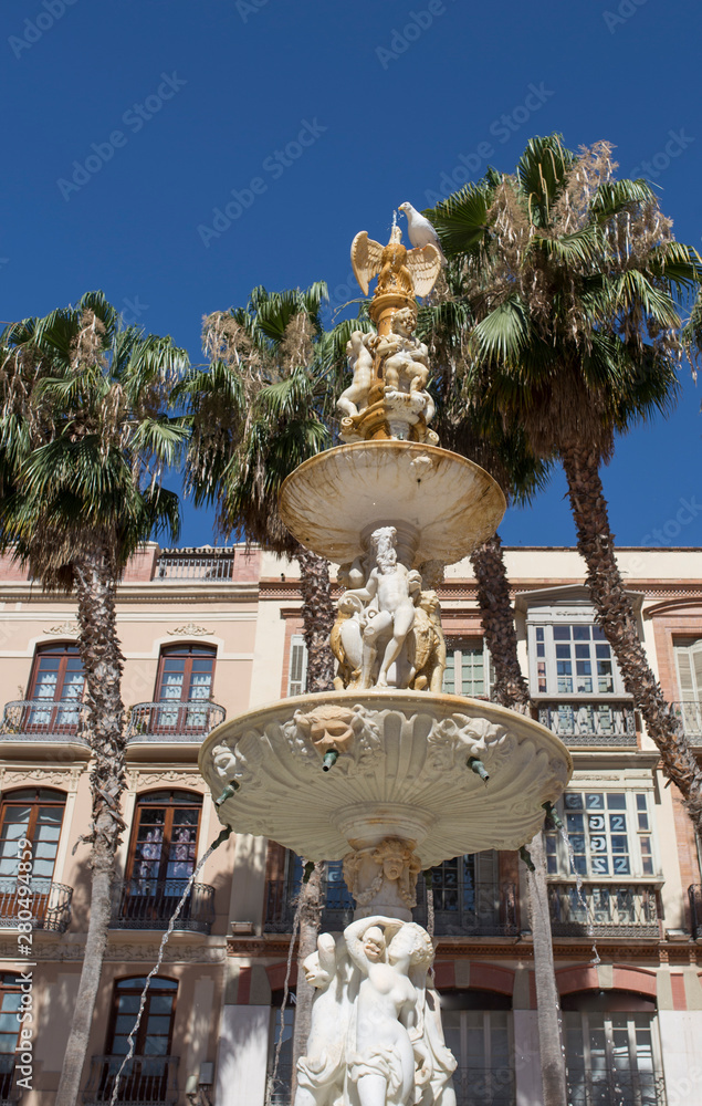 Monumental fountain at Constitucion Square, Malaga Spain
