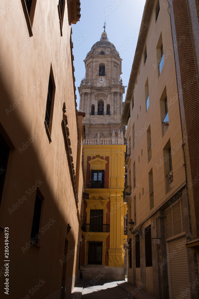 Malaga Cathedral tower from old town streets, Spain