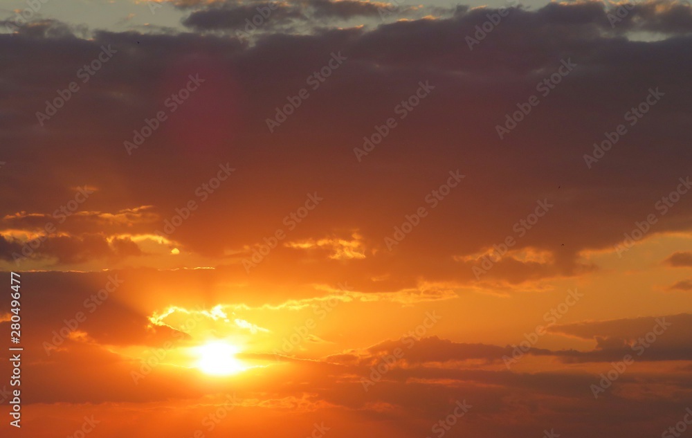 Beautiful orange fiery sunset in the sky, natural background