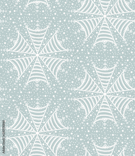 Seamless pattern. Hand drawn abstract winter snowflakes. Stylish crystal stars on cream background. Elegant boho holiday all over print. 