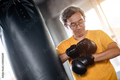 Elderly man boxing in the gym © Seksan
