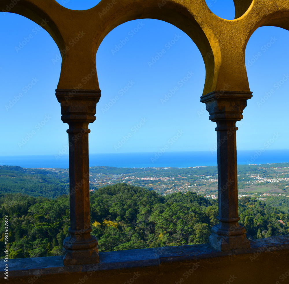 Fototapeta premium Arches and Columns on Building Terrace Overlooking the Ocean