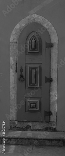 Very Small Old Narrow Doorway in Stone Castle Wall