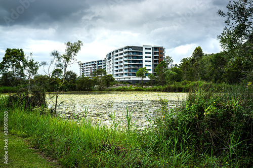 Decorative lake and residetial building at Varsity Lakes suburb in Queensland, Australia