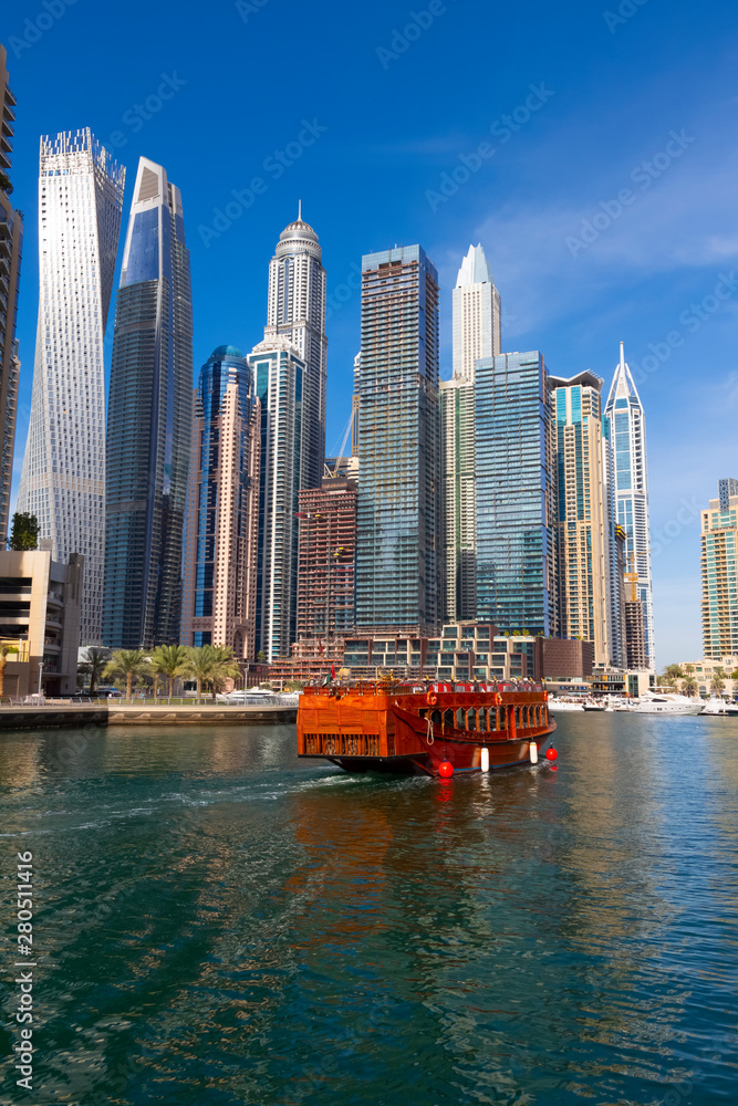 Fototapeta premium Water taxis and pleasure boats. Dubai Marina District.