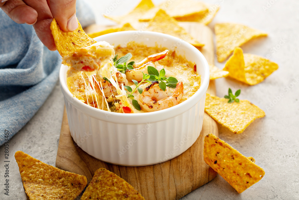 © fahrwasser - Spicy seafood dip in a ramekin with corn chips © fahrwasser - Spicy seafood dip in a ramekin with corn chips