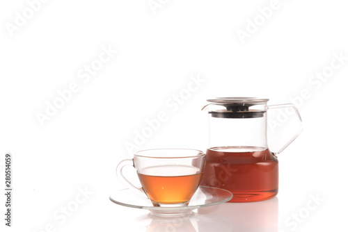 Cup of tea and teapot on white background