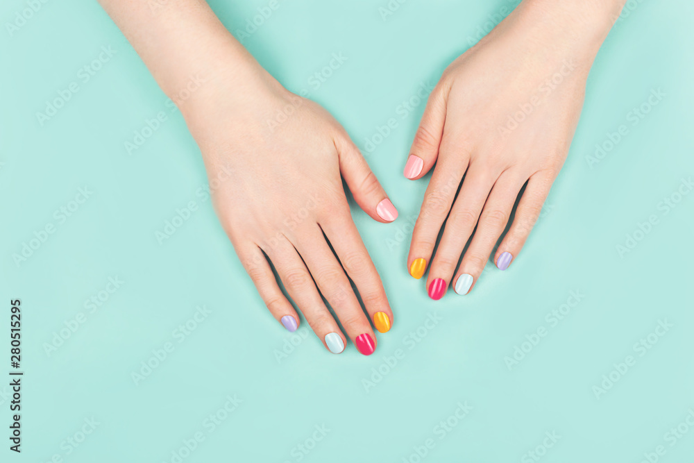 Woman hands with perfect colorful manicure.