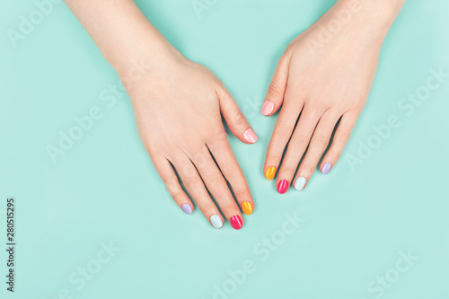 Woman hands with perfect colorful manicure.