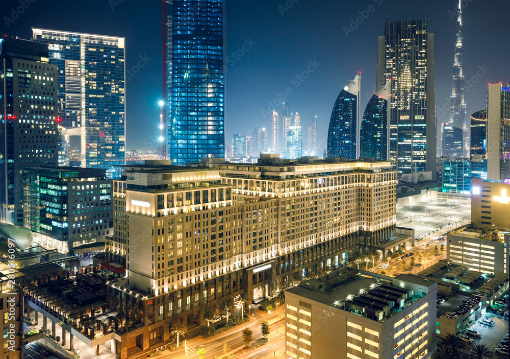 Fototapeta premium Downtown Dubai at night. Scenic aerial view on highways and skyscrapers.