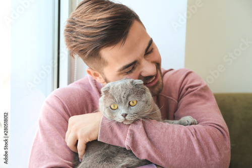 Young man with cute funny c...