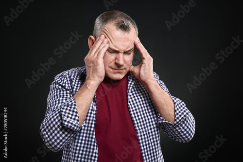 Handsome middle-aged man su...