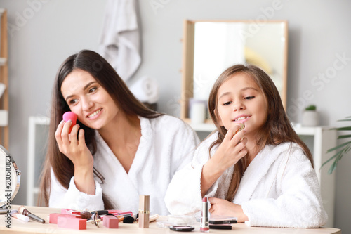 Mother and her little daugh...