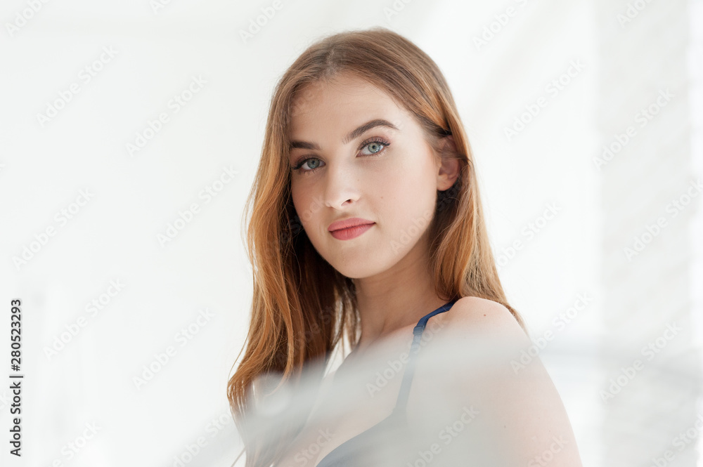 Beautiful hot young woman blue underwear posing in white interior Beautiful hot young woman blue underwear posing in white interior