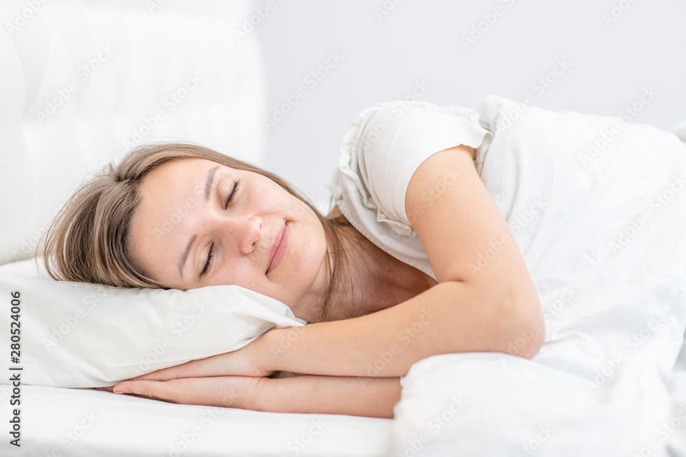 Beautiful smiling girl sleeps in the bedroom at home Beautiful smiling girl sleeps in the bedroom at home