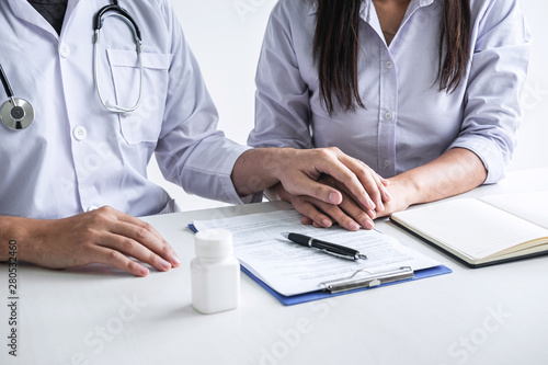Image of doctor holding patient s hand to encourage  talking with patient cheering and support  healthcare and medical assistant