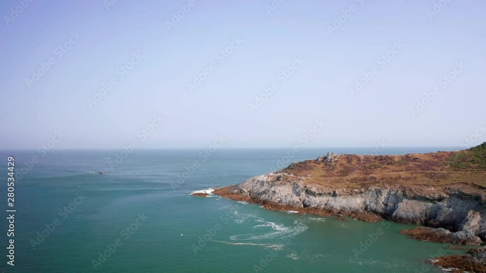 Aerial Fly Past of a Slate Cliff Headland in North Devon on a Summer’s Morning Aerial Fly Past of a Slate Cliff Headland in North Devon on a Summer’s Morning