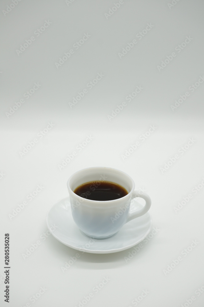 White cup of coffee on white background