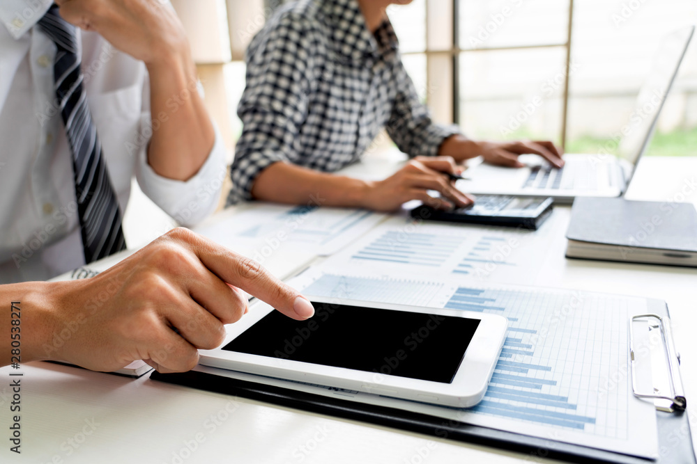 Fototapeta premium Business People Talking Discussing with coworker planning analyzing financial document data charts and graphs in Meeting and successful teamwork Concept.