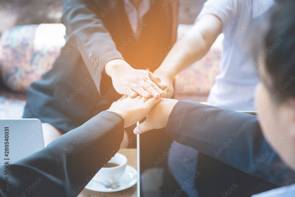 Close up of young asian business woman top view putting their hands together. Unity and teamwork concept,process in vintage style. Close up of young asian business woman top view putting their hands together. Unity and teamwork concept,process in vintage style.