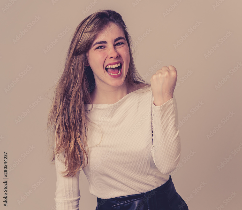 Surprised happy teenager girl celebrating victory goal or having lots of followers in social media Surprised happy teenager girl celebrating victory goal or having lots of followers in social media