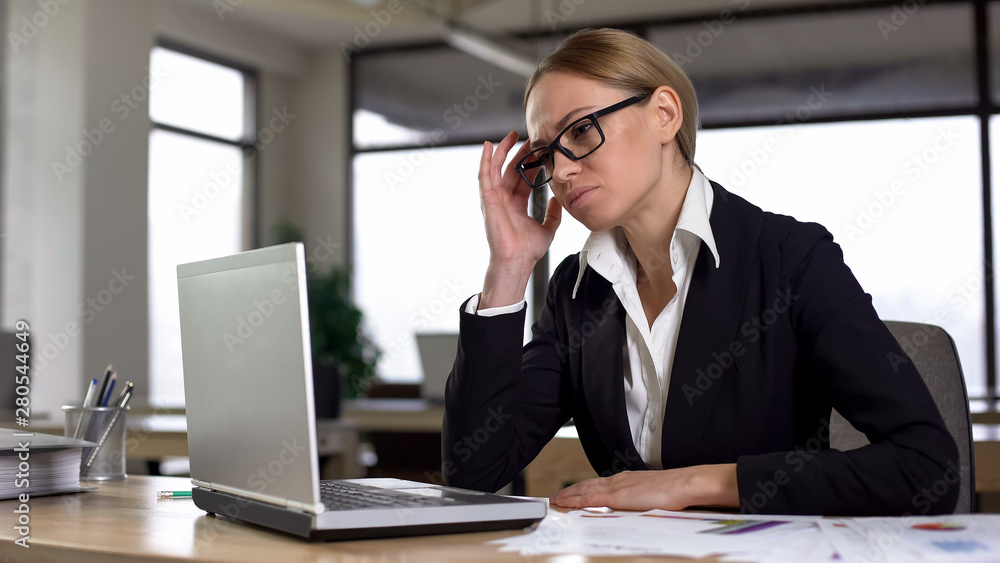 Business woman feeling strong headache in office, massaging temple, healthcare Business woman feeling strong headache in office, massaging temple, healthcare